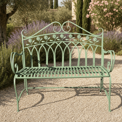Banco de jardín de metal verde con respaldo decorado con flores