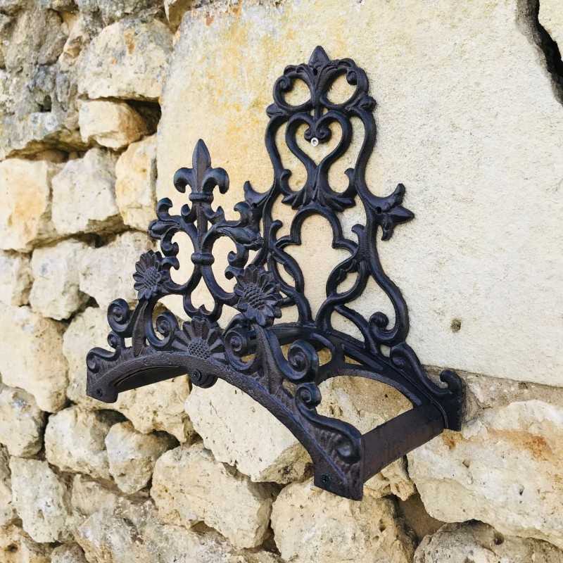Portamanguera de pared de hierro fundido marrón