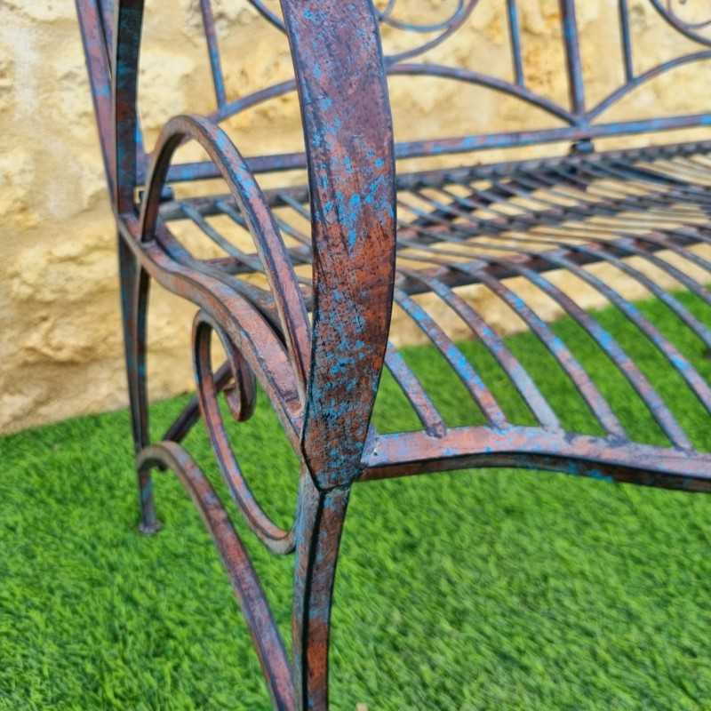 Banc de jardin fer forgé patiné rouille antique confortable vue de l'acoudoire