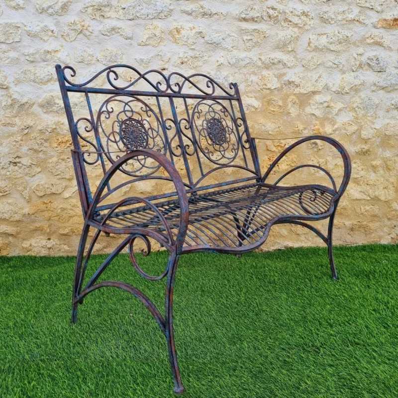 Banc de jardin fer forgé patiné rouille antique confortable vue de profil