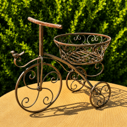 Triciclo portamacetas vintage con pájaro decorativo